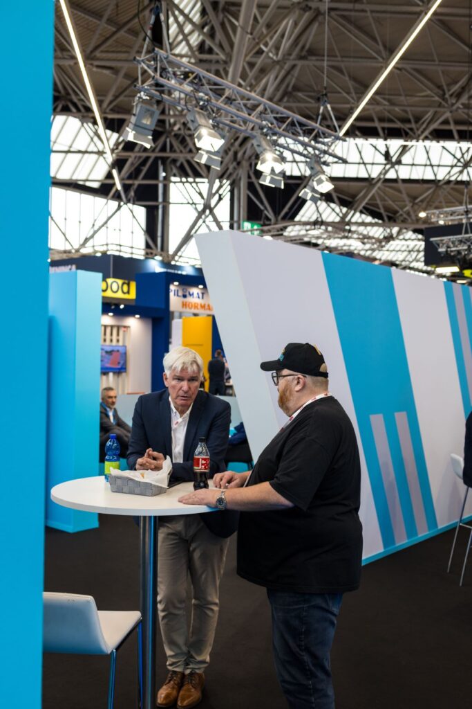 Simon talking to a customer