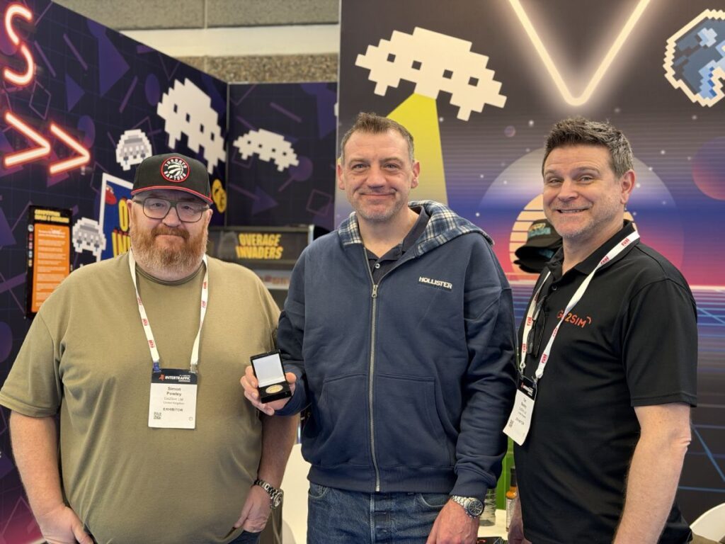 Tim and Simon presenting the coin