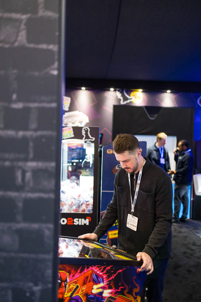man playing pinball