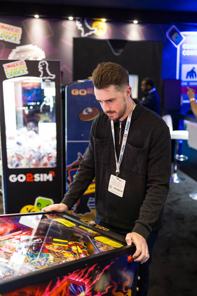 Man playing pinball for the high score competition
